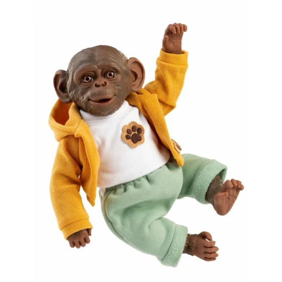 Aranyos baba majom sárga pulóverben puha szövettesttel és vinil végtagokkal, 32 cm.