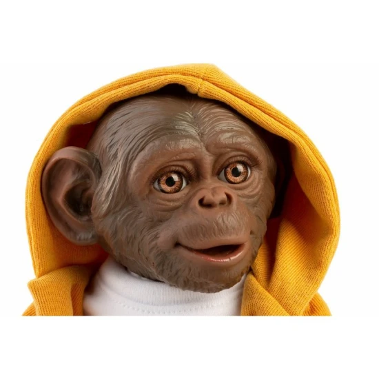 Aranyos baba majom sárga pulóverben puha szövettesttel és vinil végtagokkal, 32 cm.