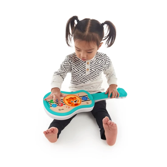 Zenélő játék fa ukulele Magic Touch HAPE 6m+ Baby Einstein 12609-6