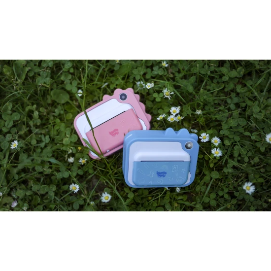 Gyerekkamera Kiddoboo FotoFun 2 Dino Pink - rózsaszín azonnali kamera gyerekeknek azonnali nyomtatással, színes markerekkel és szórakoztató képkeretekkel.