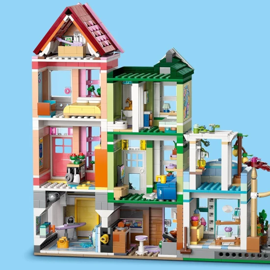 LEGO® Friends 42670 Heartlake apartmanok és üzletek – kreatív építőkészlet 9 karakterrel, pékséggel, kerámiastúdióval és egyéb részletekkel.