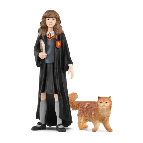 Hermione Granger egy könyvvel a hóna alatt, és a macskájával, a görbe lábakkal az oldalán.