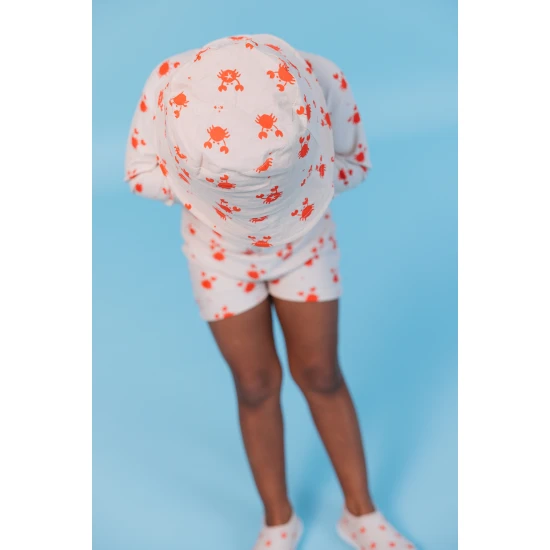 Kifordítható kalap gyerekeknek UPF 50+ - egyik oldalán rákmintával, másik oldalán egyszínű dizájnnal. Széles karimájú napvédelem.