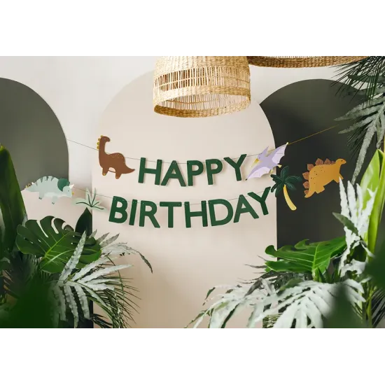 Egy gyönyörű füzér Happy Birthday felirattal és különféle rajzfilm dinoszauruszok. 